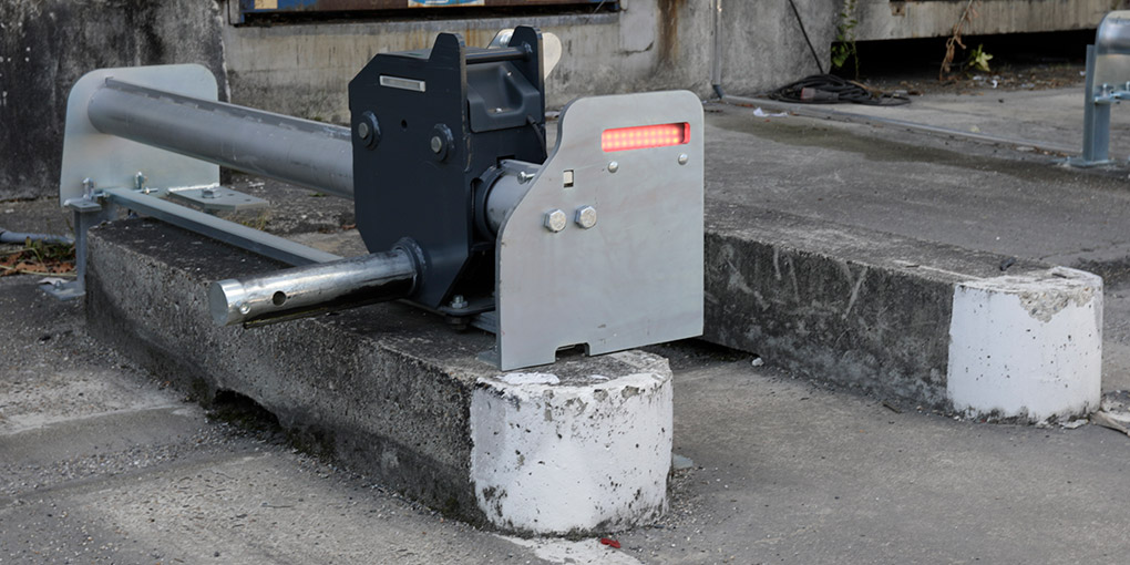 Inutile de reprendre le génie civil de votre cour de chargement pour installer des cale-roue bloqueurs à chaque quai de chargement